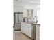 Modern kitchen with stainless steel appliances, granite countertops, and white cabinets at 516 Tidewater Chase Ln, Summerville, SC 29486