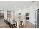 Spacious open-concept kitchen boasts granite counters, stainless appliances, a large island, and ample cabinet space at 516 Tidewater Chase Ln, Summerville, SC 29486