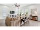Living room offers a comfortable seating area, large windows, and a view to outdoor seating at 516 Tidewater Chase Ln, Summerville, SC 29486