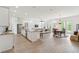Bright open-concept living space features modern kitchen, dining area, and comfortable living room at 516 Tidewater Chase Ln, Summerville, SC 29486