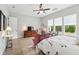 Relaxing main bedroom featuring a ceiling fan, comfortable furniture, natural light, and light-colored walls at 516 Tidewater Chase Ln, Summerville, SC 29486