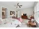 Spacious main bedroom with ceiling fan, natural light from windows, and comfortable seating and furniture at 516 Tidewater Chase Ln, Summerville, SC 29486