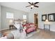 Bright bedroom with ceiling fan, comfortable seating and an en suite bathroom with a glass-enclosed shower at 516 Tidewater Chase Ln, Summerville, SC 29486