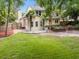 View of backyard with privacy fence, mature trees, and raised garden beds at 5488 Altamaha Dr, North Charleston, SC 29420