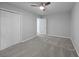 Carpeted bedroom features ceiling fan, and double closet, providing ample storage at 5488 Altamaha Dr, North Charleston, SC 29420