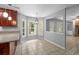 Bright breakfast nook featuring large windows, tile floors, and access to the backyard at 5488 Altamaha Dr, North Charleston, SC 29420