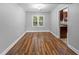 Bright dining room featuring wood floors and large window offering natural light at 5488 Altamaha Dr, North Charleston, SC 29420