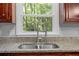 Kitchen sink with granite countertops and a modern faucet at 5488 Altamaha Dr, North Charleston, SC 29420