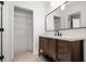 Updated bathroom vanity with a modern mirror and a glimpse into the closet at 655 Swinton Ct, Mount Pleasant, SC 29464