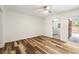 Empty bedroom with neutral walls, light-colored floors, a fan, and a sliding door to the backyard at 655 Swinton Ct, Mount Pleasant, SC 29464