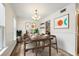 Elegant dining room with modern decor, stylish chandelier, and views to the kitchen at 655 Swinton Ct, Mount Pleasant, SC 29464