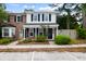 Lovely townhome boasts a mix of brick and siding, framed by mature trees and greenery at 655 Swinton Ct, Mount Pleasant, SC 29464
