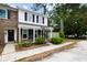 Inviting townhome showcases a blend of brick and siding, complemented by lush green shrubs at 655 Swinton Ct, Mount Pleasant, SC 29464