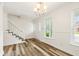 Welcoming foyer with a staircase and window, offering a bright and inviting entry at 655 Swinton Ct, Mount Pleasant, SC 29464