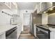 Bright kitchen features stainless steel appliances, white cabinets, and modern finishes at 655 Swinton Ct, Mount Pleasant, SC 29464