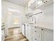 Bright kitchen features white cabinetry, stone countertops, and stainless steel fixtures at 655 Swinton Ct, Mount Pleasant, SC 29464