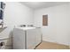Bright laundry room features a side-by-side washer and dryer, tile floors, and white walls at 655 Swinton Ct, Mount Pleasant, SC 29464