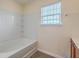 Bathroom features a standard tub-shower combination with a window at 7675 High Maple Cir, North Charleston, SC 29418