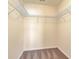Empty closet space with wire shelving for organized storage and neutral carpet flooring at 7675 High Maple Cir, North Charleston, SC 29418
