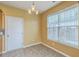 Cozy dining area filled with natural light from a large window and adjacent to the kitchen at 7675 High Maple Cir, North Charleston, SC 29418