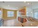 Well-lit kitchen featuring a large window, stainless steel sink and cherry cabinets at 7675 High Maple Cir, North Charleston, SC 29418