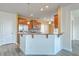 Modern kitchen with stainless steel appliances, granite countertops, and an open layout at 7675 High Maple Cir, North Charleston, SC 29418