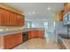 Stylish kitchen with granite countertops, cherry cabinets and stainless steel appliances at 7675 High Maple Cir, North Charleston, SC 29418