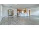 The open layout connects the living space and kitchen, enhanced by abundant natural light at 7675 High Maple Cir, North Charleston, SC 29418