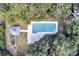 Aerial view of community pool surrounded by mature trees, and pool house nearby at 828 Bridge Point Cir, Mount Pleasant, SC 29464