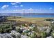 Aerial view of property and surrounding neighborhood with the Ravenel Bridge in the background on a clear, sunny day at 828 Bridge Point Cir, Mount Pleasant, SC 29464