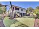 Backyard features a fenced yard, lush green lawn, and a deck with stairs descending from the upper level at 828 Bridge Point Cir, Mount Pleasant, SC 29464