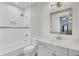 Bathroom featuring a shower-tub, neutral tiling, and framed mirror at 828 Bridge Point Cir, Mount Pleasant, SC 29464