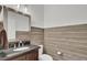 Stylish powder room featuring shiplap walls, granite countertop, and modern fixtures at 828 Bridge Point Cir, Mount Pleasant, SC 29464