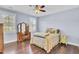 Inviting bedroom with a ceiling fan, natural light, and hardwood flooring at 828 Bridge Point Cir, Mount Pleasant, SC 29464
