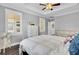Bedroom showcases a tray ceiling, hardwood floors, and a dresser with a light and airy feel at 828 Bridge Point Cir, Mount Pleasant, SC 29464