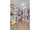 Spacious walk-in closet with custom shelving, hardwood floors, and ample storage space at 828 Bridge Point Cir, Mount Pleasant, SC 29464