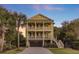 Stately three-story home with balconies, a garage, and lovely landscaping at 828 Bridge Point Cir, Mount Pleasant, SC 29464