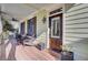 Charming front porch with comfortable seating, a ceiling fan, and an inviting front door at 828 Bridge Point Cir, Mount Pleasant, SC 29464