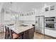 A spacious kitchen boasting stainless steel appliances, granite countertops, and custom cabinetry with glass fronts at 828 Bridge Point Cir, Mount Pleasant, SC 29464