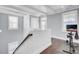 Bright upper landing area with exercise bike, hardwood floors, and natural light at 828 Bridge Point Cir, Mount Pleasant, SC 29464
