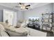 Comfortable living room with modern furnishings, ceiling fan, and entertainment center at 828 Bridge Point Cir, Mount Pleasant, SC 29464