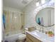 Bathroom featuring marble countertop vanity and tub/shower with decorative tile at 851 Sandlake Dr # D, Mount Pleasant, SC 29464