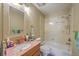 Bathroom with tub shower combination, marble sink, and wood vanity at 851 Sandlake Dr # D, Mount Pleasant, SC 29464