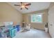 Second bedroom with ceiling fan and large window at 851 Sandlake Dr # D, Mount Pleasant, SC 29464