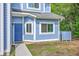 Inviting blue townhome with a classic design, featuring a tidy lawn and a neatly defined walkway to the front door at 851 Sandlake Dr # D, Mount Pleasant, SC 29464