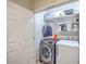 Laundry room with a new front load washing machine and white dryer at 851 Sandlake Dr # D, Mount Pleasant, SC 29464