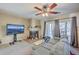 Inviting living room features a comfortable sectional sofa, fireplace, and sliding doors that offer outdoor views at 851 Sandlake Dr # D, Mount Pleasant, SC 29464