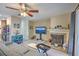 Cozy living room featuring a fireplace, ceiling fan, and comfortable gray sofa at 851 Sandlake Dr # D, Mount Pleasant, SC 29464