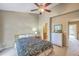 Bedroom with ceiling fan, ensuite bathroom, and hallway access at 851 Sandlake Dr # D, Mount Pleasant, SC 29464
