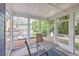 Enclosed patio showcasing a view of the community pond with a fountain at 851 Sandlake Dr # D, Mount Pleasant, SC 29464
